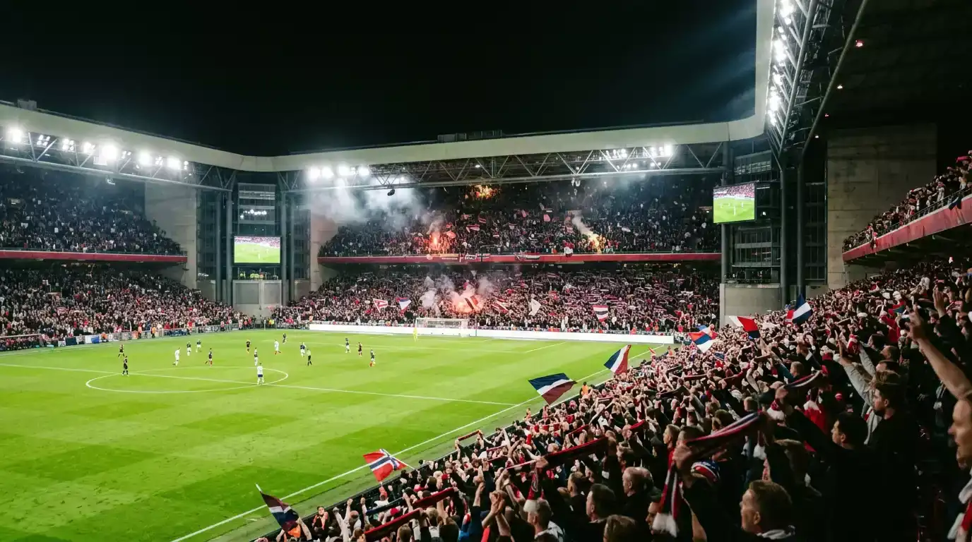 Et fotballstadion fylt med jublende supportere under en kveldskamp i VM 2026